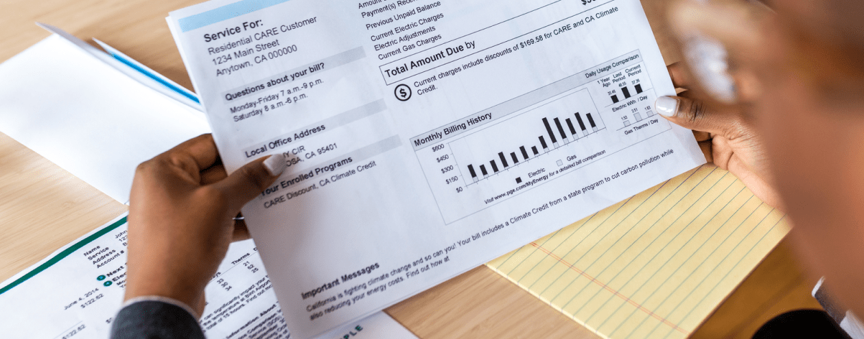 A homeowner reads their utility bill